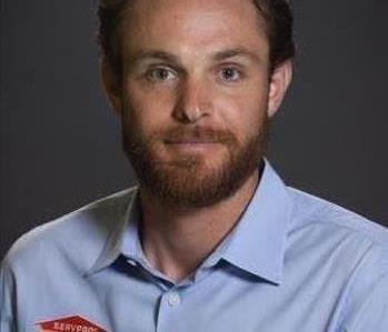 Male Employee with blue SERVPRO shirt brown hair and beard.